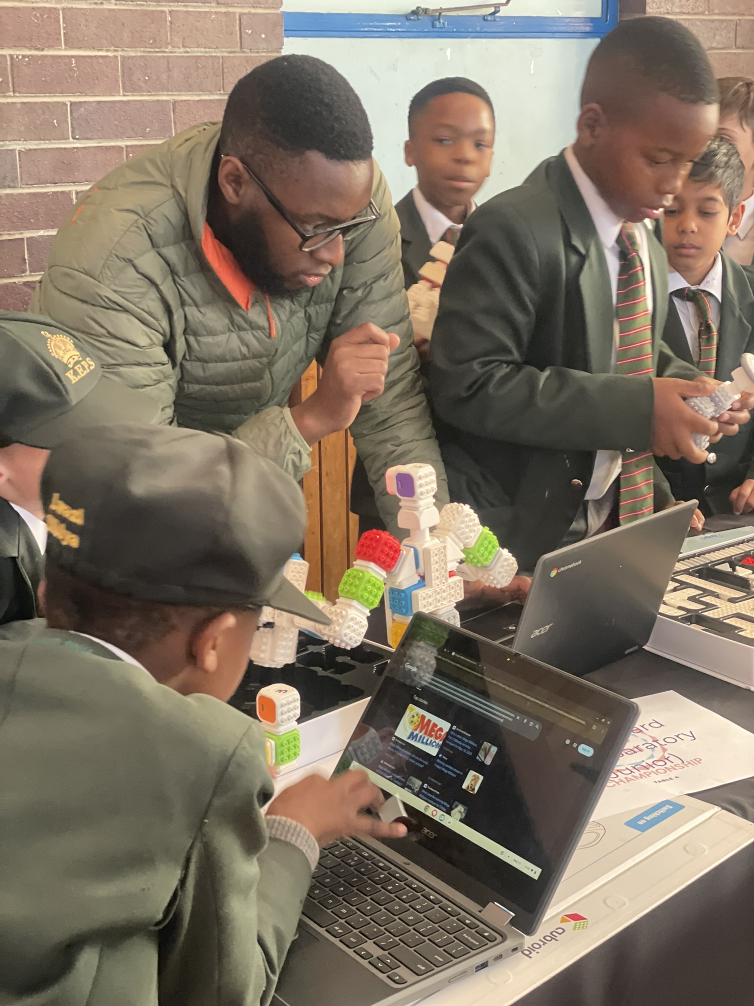 Teachers in training on their first coding kit.